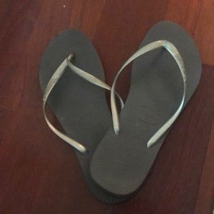 Silver and gray flip flops